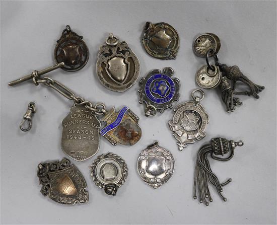 Twelve assorted fobs and medals including silver.